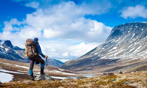 Tourist,With,A,Backpack,And,Mountain,Panorama